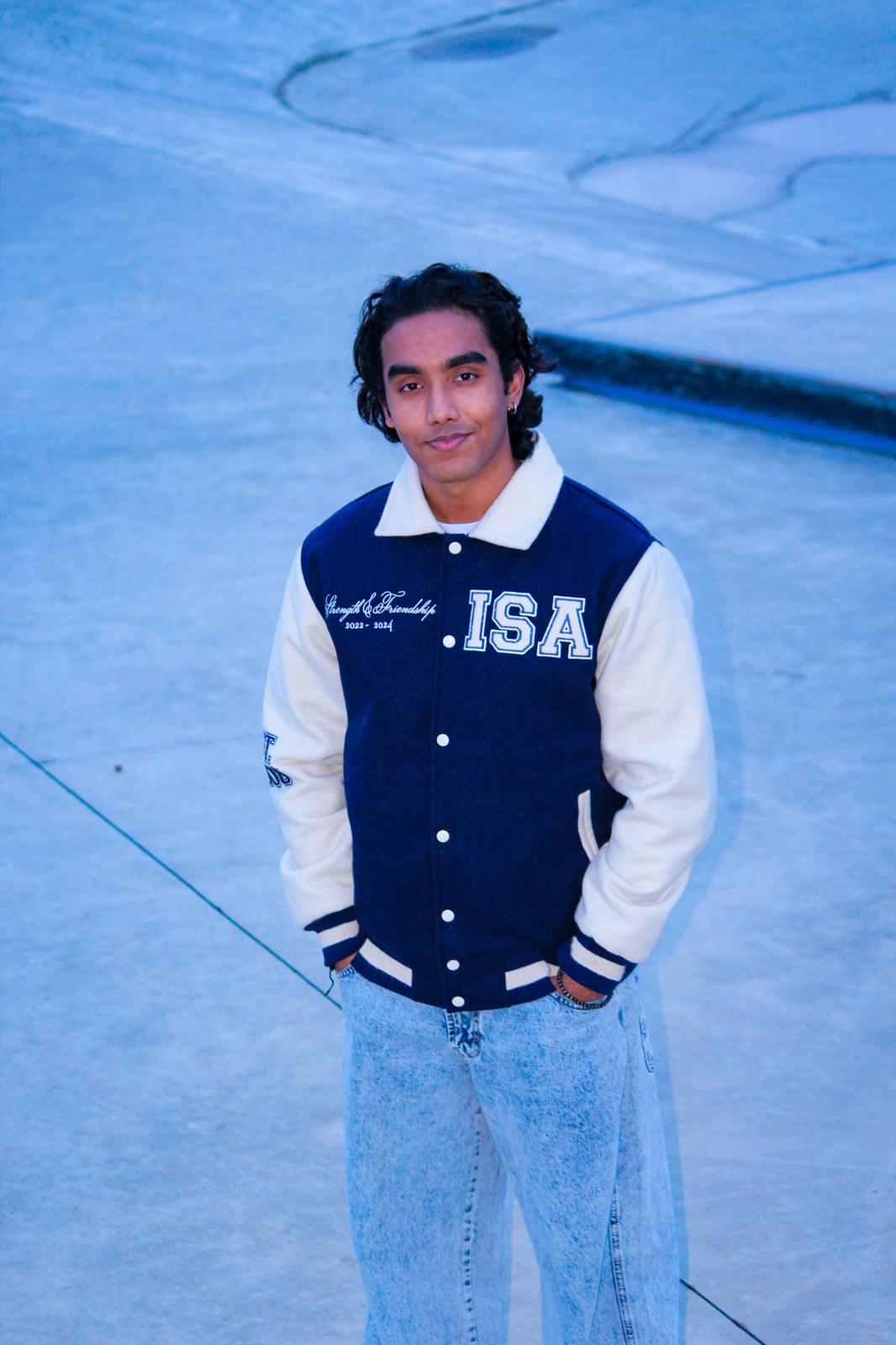 Student wearing ISA varsity jacket — front portrait